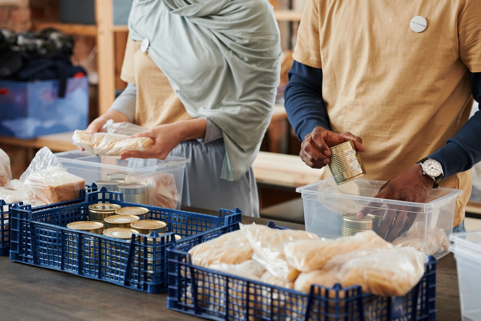 Volunteers preparing food parcels for distribution